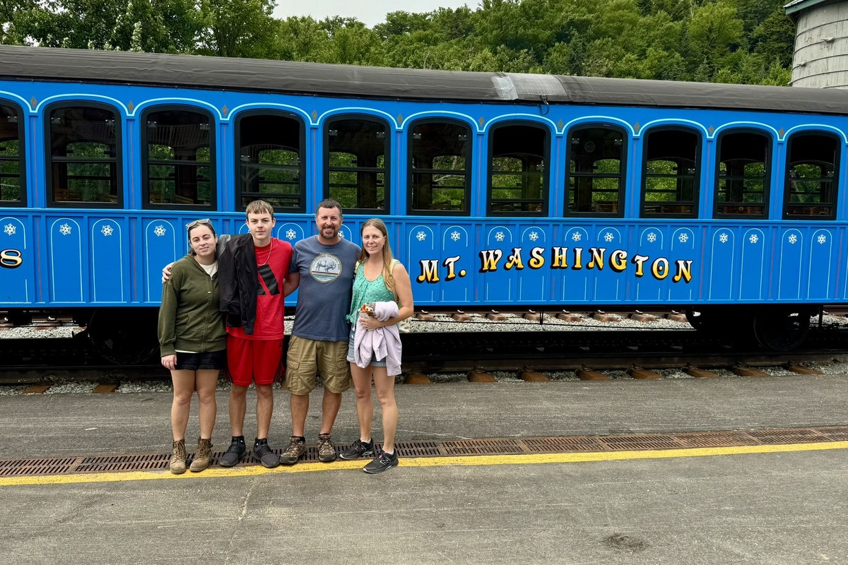 Family beside the Mount Washington Cog Railway