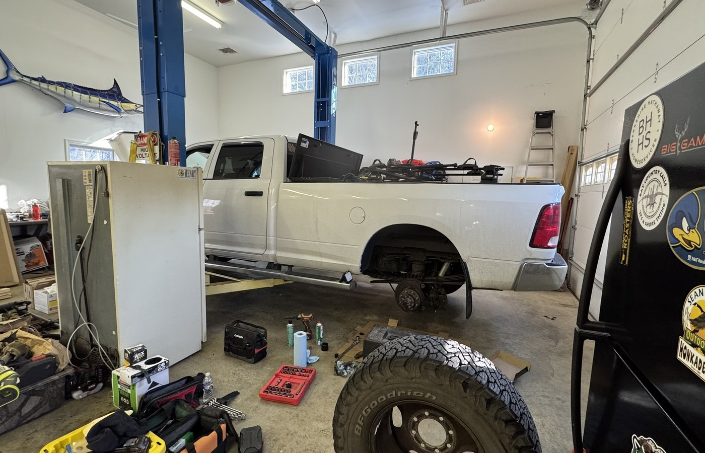 Campfires and Motors tow vehicle being serviced in a repair shop